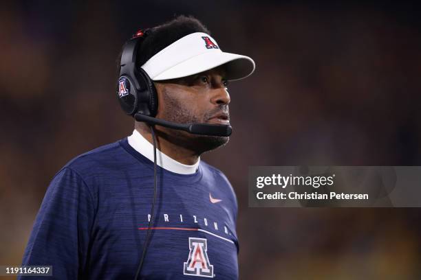 Head coach Kevin Sumlin of the Arizona Wildcats watches from the sidelines during the first half of the NCAAF game against the Arizona State Sun...