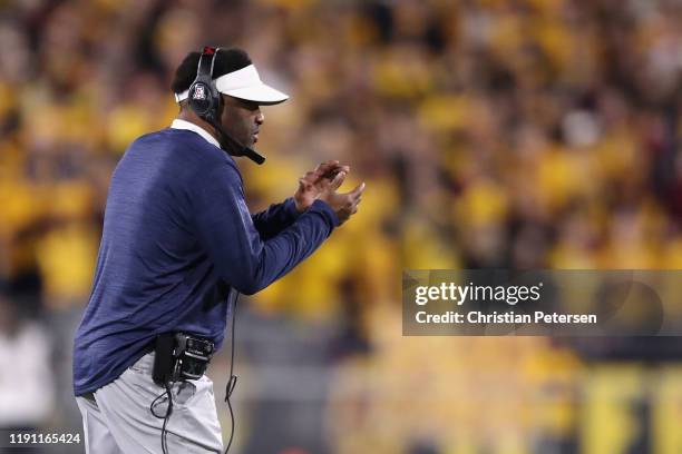 Head coach Kevin Sumlin of the Arizona Wildcats watches from the sidelines during the first half of the NCAAF game against the Arizona State Sun...