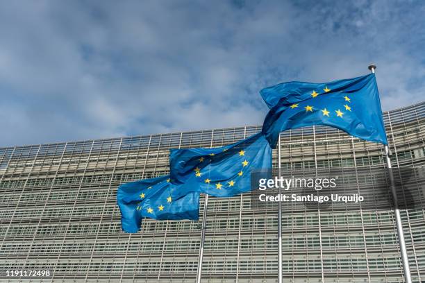 european union flags at berlaymont building of the european commission - eec headquarters stock pictures, royalty-free photos & images