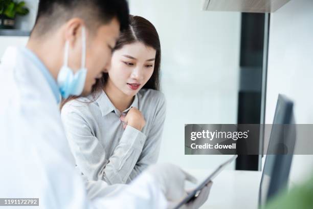 asian dentist and patient in doctor's office - china exam stock pictures, royalty-free photos & images