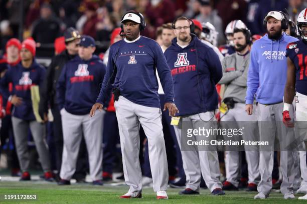 Head coach Kevin Sumlin of the Arizona Wildcats watches from the sidelines during the second half of the NCAAF game against the Arizona State Sun...