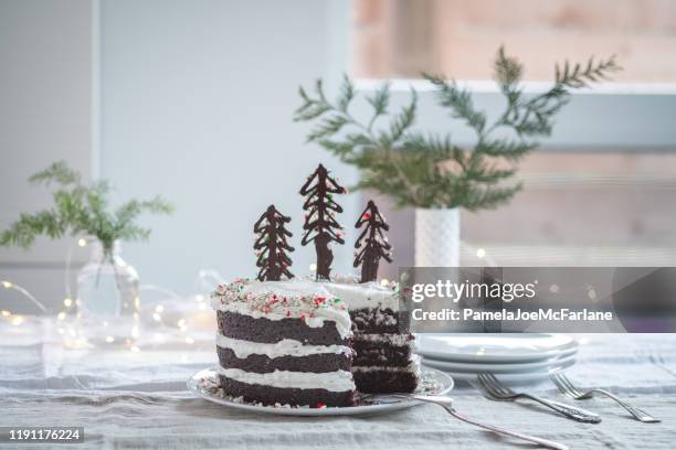 vegan, christmas chocolate cake decorated with chocolate candy cane trees - winter dinner party stock pictures, royalty-free photos & images