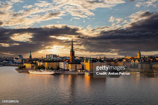 sunset view of gamla stan, view of old buildings. stockholm, sweden - stockholm summer stock-fotos und bilder