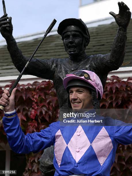 Frankie Dettori stands in front of a statue to comemerate his seven wins on one day at Ascot in 1996, the popular jockey unveiled the life size work...