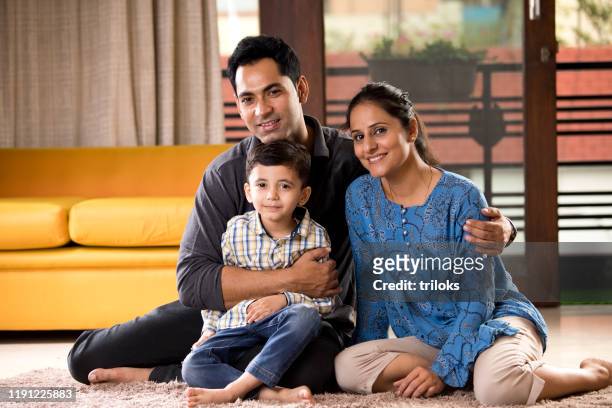 happy indian family at home - indian wife stock pictures, royalty-free photos & images