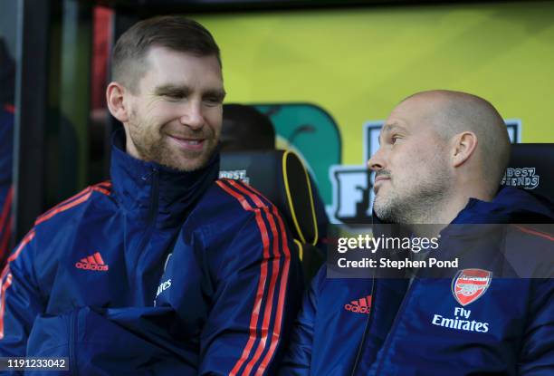 Interim Manager of Arsenal, Freddie Ljungberg next to Per Mertesacker during the Premier League match between Norwich City and Arsenal FC at Carrow...
