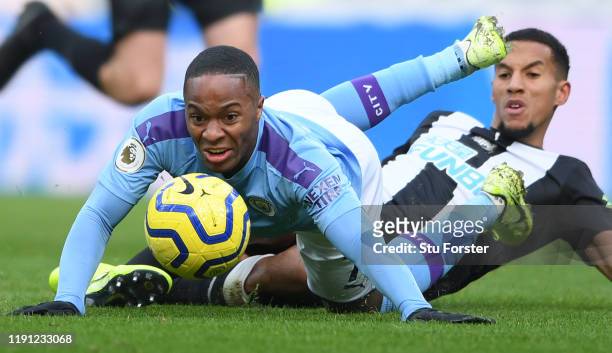 City player Raheem Sterling is challenged by Isaac Hayden during the Premier League match between Newcastle United and Manchester City at St. James...