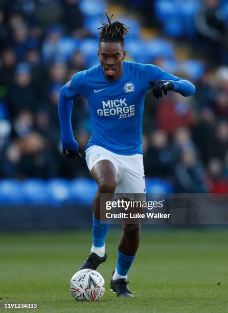 Ivan Toney of Peterborough runs with the ball on his way to scoring the first goal of the match during the FA Cup Second Round match between...
