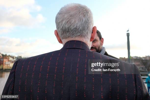Labour Party leader Jeremy Corbyn wears a suit with the slogan "For The Many Not The Few' woven into the fabric as he meets Labour activists in...