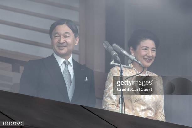 Empress Masako looks on as Emperor Naruhito of Japan delivers a traditional New Year's greeting at the Imperial Palace on January 2, 2020 in Tokyo,...