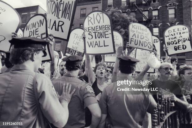 On June 6 AIDS activists protest during the dedication ceremony of Stonewall Place on Christopher Street in Greenwich Village, New York.