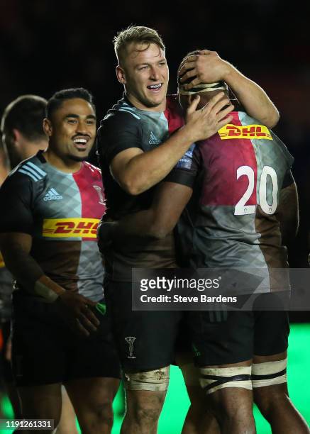 Alex Dombrandt and Semi Kunatani of Harlequins embrace during the Gallagher Premiership Rugby match between Harlequins and Gloucester Rugby at...