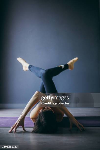 yogi woman practicing yoga lesson - bikram yoga stock pictures, royalty-free photos & images