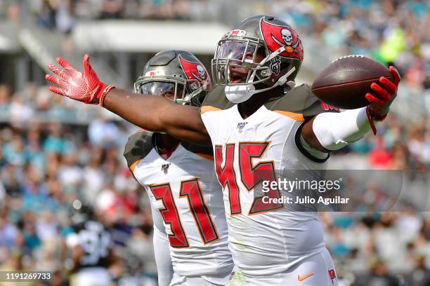 Devin White of the Tampa Bay Buccaneers celebrates after intercepting Nick Foles of the Jacksonville Jaguars in the first quarter of a football game...
