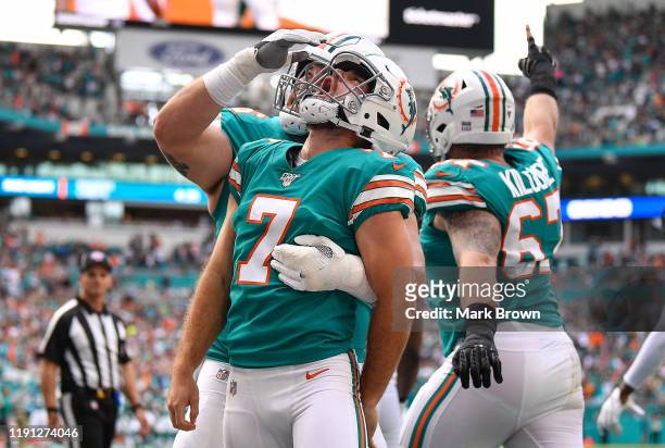 Jason Sanders of the Miami Dolphins celebrates a touchdown pass from a fake field goal against the Philadelphia Eagles in the second quarter at Hard...