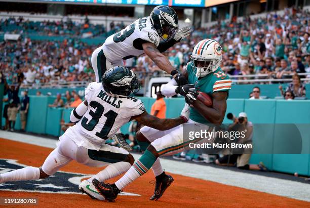 DeVante Parker of the Miami Dolphins catches a touchdown against the Philadelphia Eagles in the third quarter at Hard Rock Stadium on December 01,...