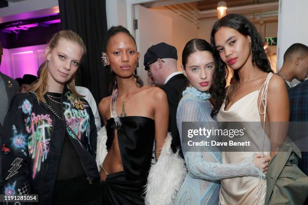 Lexi Boling, Adesuwa Aighewi, Iris Law and Jordan Daniels attend the LOVE Christmas Drinks at Bistrotheque on December 01, 2019 in London, England.