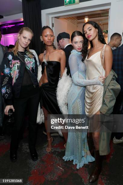 Lexi Boling, Adesuwa Aighewi, Iris Law and Jordan Daniels attend the LOVE Christmas Drinks at Bistrotheque on December 01, 2019 in London, England.
