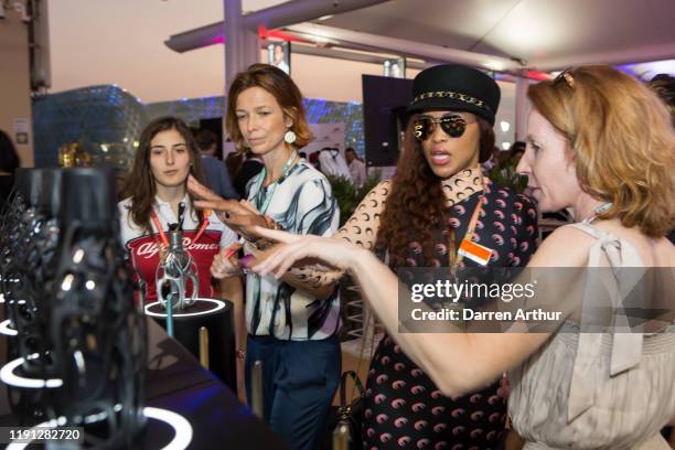 Racer Tatiana Calderón and American rap artist Eve at the launch of the F1 fragrance at the Formula 1 Etihad Airways Grand Prix, Yas Marina Circuit...