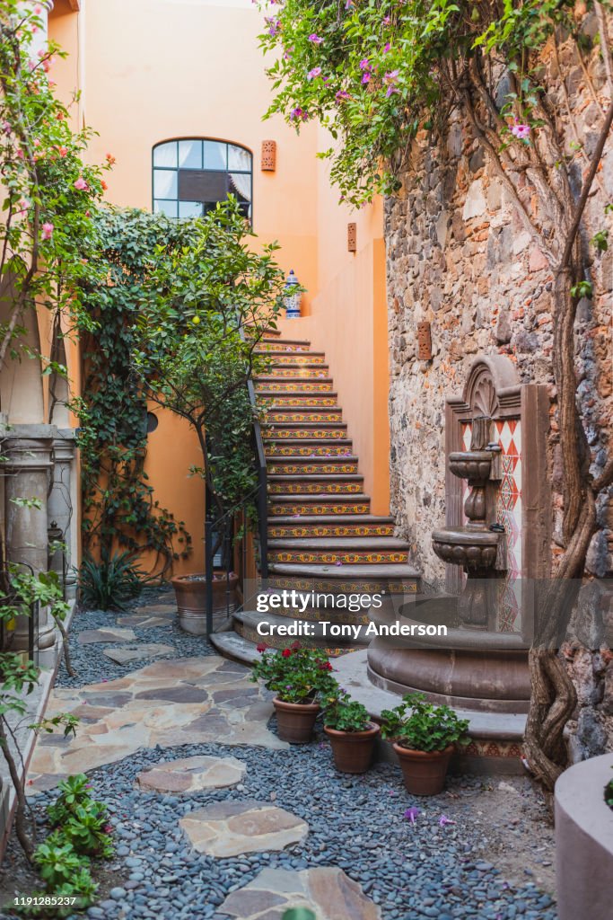 Interior Of Courtyard With Staircase And Fountain High-Res Stock Photo ...