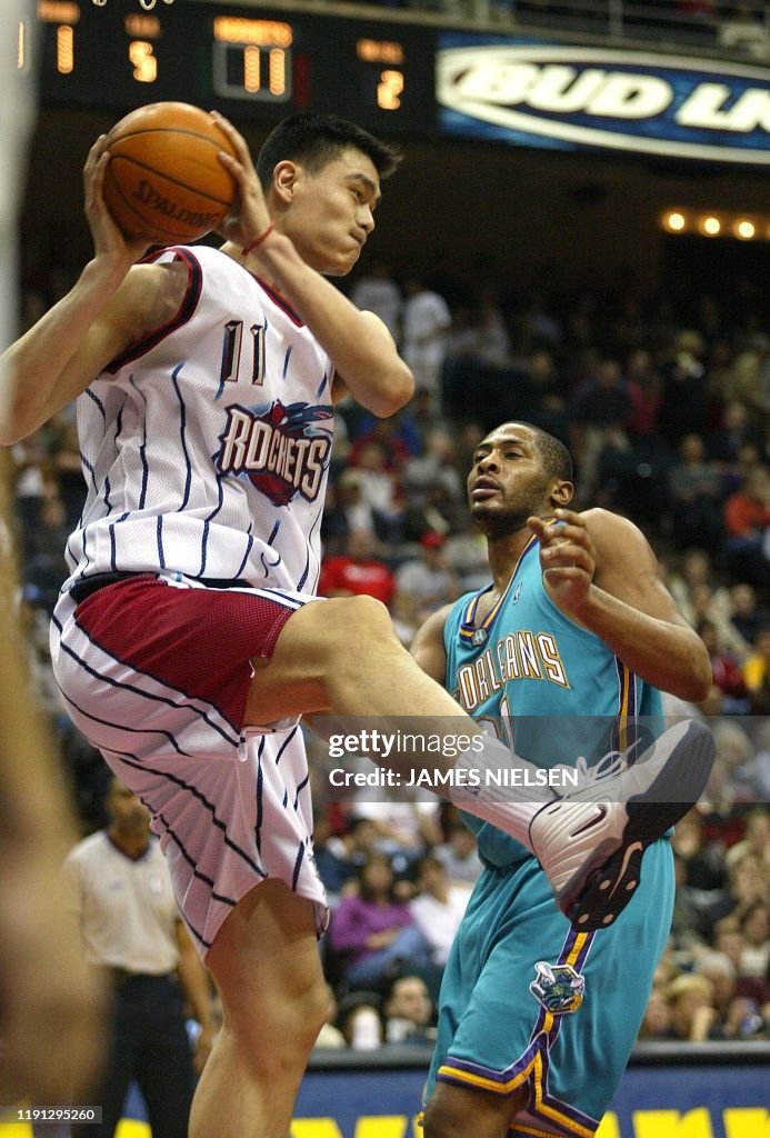 Hornets Rockets 2002 The Houston Rockets' Yao Ming pulls in a rebound over the New... News ...