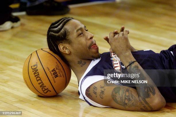 Philadelphia 76ers player Allen Iverson takes a break during the NBA All-Star East team practice session 12 February, 2000 at the Arena in Oakland,...