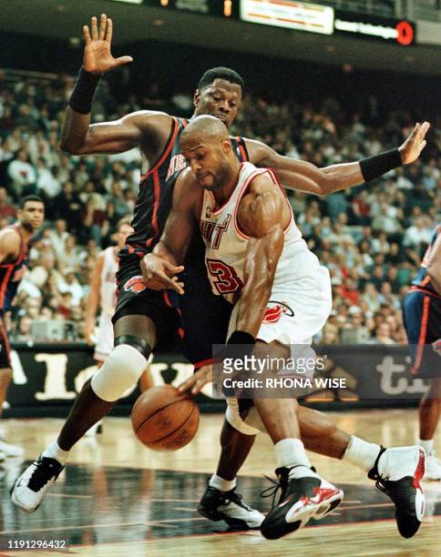 Miami Heat center Alonzo Mourning tries to get to the basket around the defense of New Your Knicks Center Patrick Ewing during first period action of...