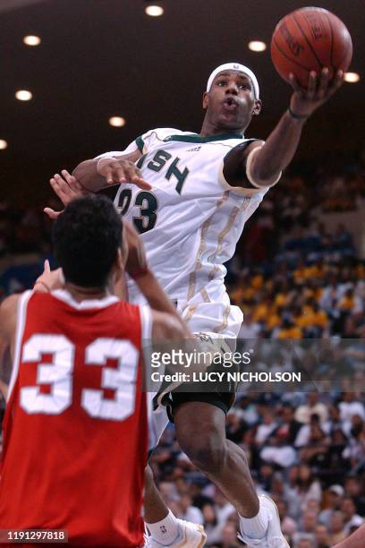 St. Vincent-St. Mary's LeBron James goes up for a basket past Mater Dei's Marcel Jones in the second quarter, in Los Angeles, CA, 04 January 2003....