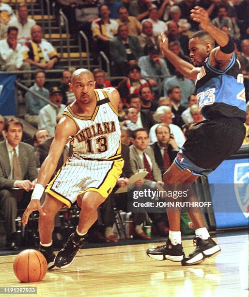 Indiana Pacers guard Mark Jackson drives around Cleveland Cavaliers guard Derek Anderson during game one of the Eastern Conference playoffs 23 April...