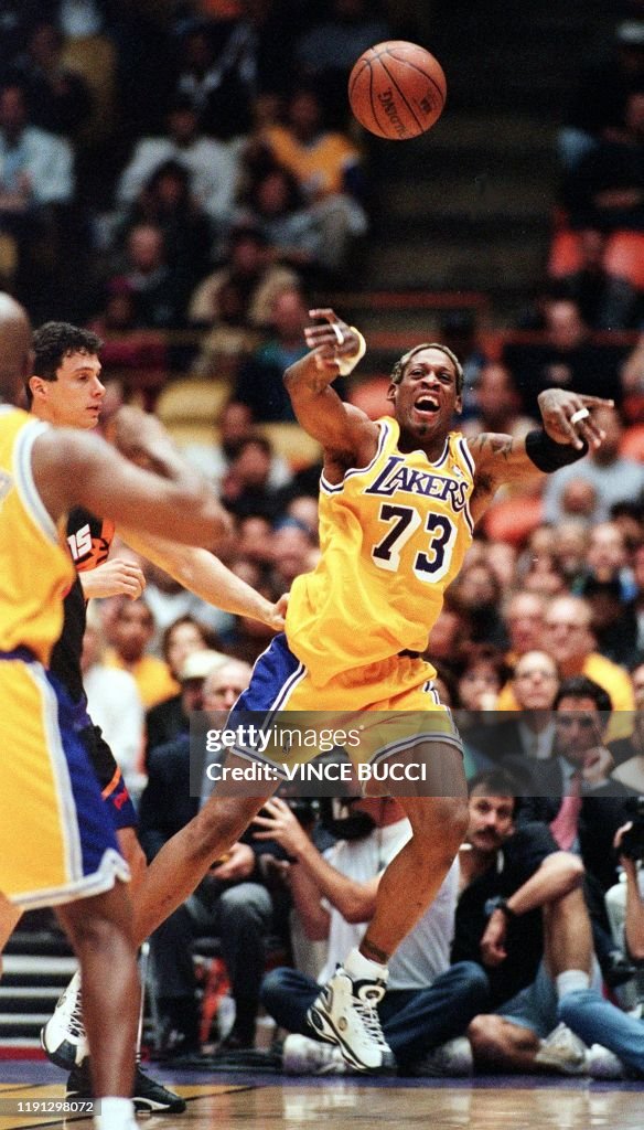 Rodman Lakers Rockets Dennis Rodman of the Los Angeles Lakers passes to a teammate after ...