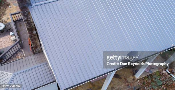 metal roof close-up - roof replacement stock pictures, royalty-free photos & images