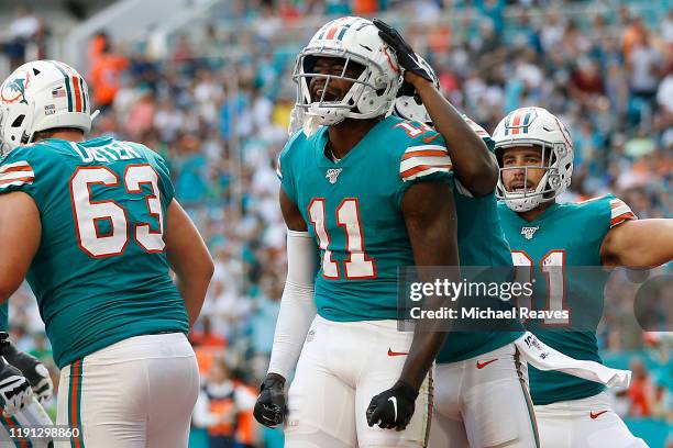 DeVante Parker of the Miami Dolphins celebrates after a touchdown against the Philadelphia Eagles at Hard Rock Stadium on December 01, 2019 in Miami,...