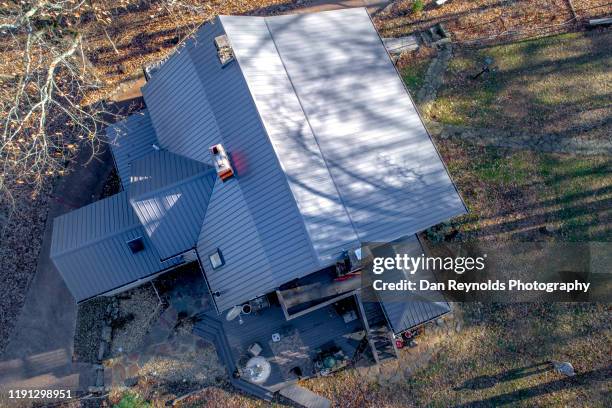 nodern metal roof - roof replacement stock pictures, royalty-free photos & images