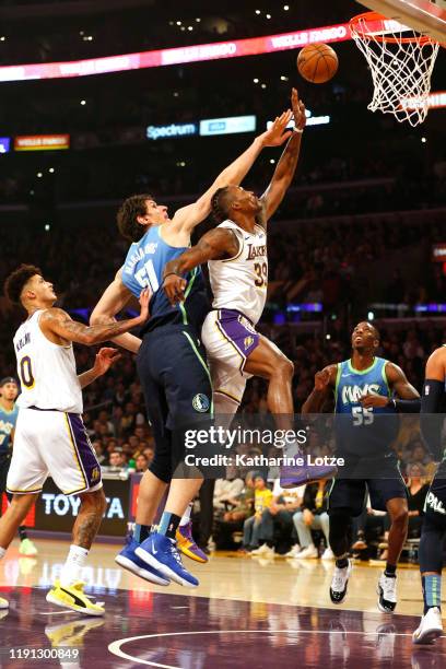 Dwight Howard of the Los Angeles Lakers and Boban Marjanovic of the Dallas Mavericks reach for a rebound during the first half at Staples Center on...