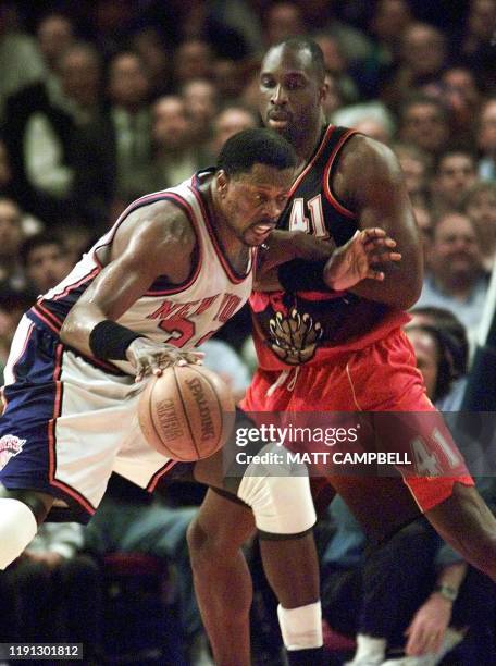 New York Knicks Patrick Ewing drives on Atlanta Hawks Mark West 24 May, 1999 during the NBA eastern conference semi-finals at Madison Square Garden...