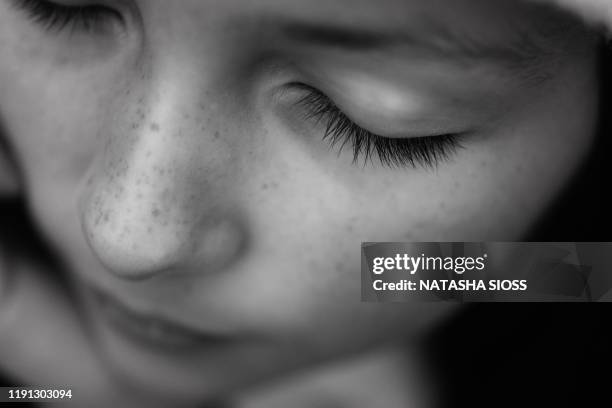 macro black and white photo of a young girl's eyelashes - child eyes closed stock pictures, royalty-free photos & images