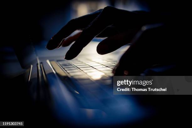 Symbolic photo on the subject of hackers and data security. Hands write on a computer keyboard on February 02, 2020 in Berlin, Germany.