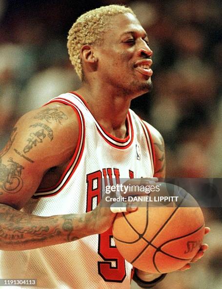 Rodman Chicago Bulls forward Dennis Rodman closes his eyes before shooting a ...