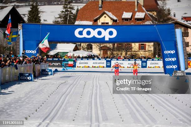 Ingvild Flugstad Oestberg of Norway and Therese Johaug of Norway at the finish during the Women's 10 km C Pursuit at the FIS Cross-Country World Cup...