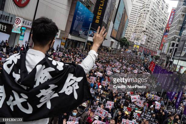 Tens of thousands of protesters marched in Hong Kong on January 1, 2020. Riot police deploy tear gas during a protest. Several protesters were...