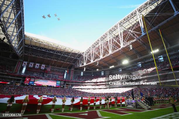 General view of the national anthem as the Air Force perform a fly-over before NFL game between the Arizona Cardinals and the Los Angeles Rams at...