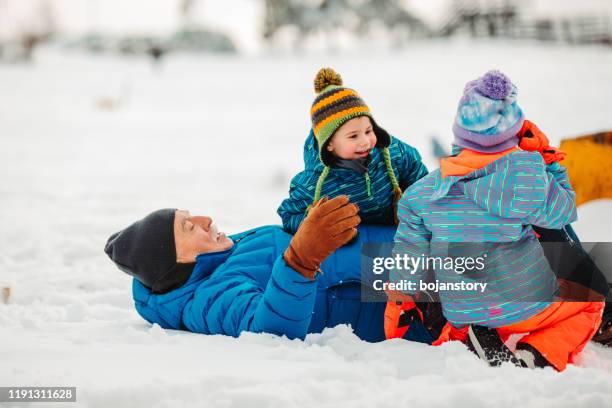 winter happiness - grandfather child snow winter stock pictures, royalty-free photos & images