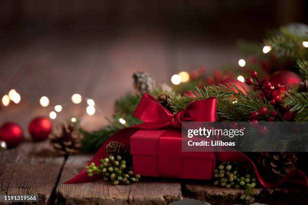 christmas gift on old wood background - christmas gift stock pictures, royalty-free photos & images