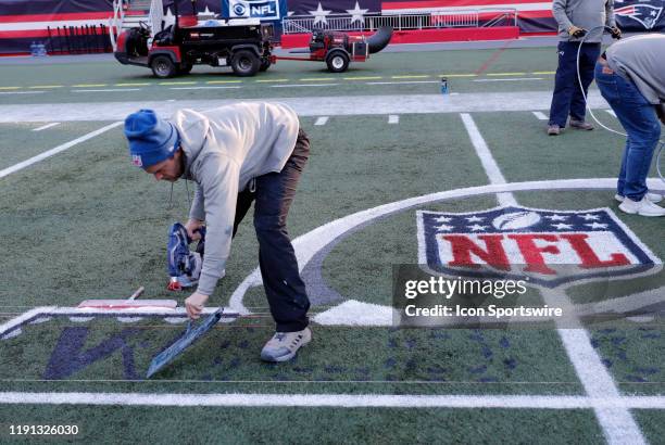 The Wild Card logo is painted on the field during press conferences in advance of the AFC Wild Card Game between the New England Patriots and the...