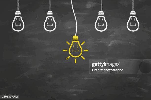 idea concepts with light bulb on chalkboard background - surrounded by computers stock illustrations