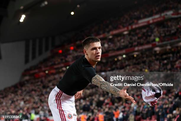 Muhamed Besic of Sheffield United throws his shirt to a fan after the Premier League match between Liverpool FC and Sheffield United at Anfield on...