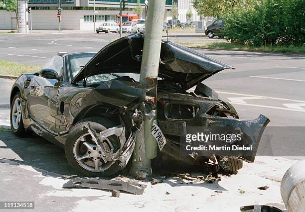 a car crashed into a lamp post - car accident stock pictures, royalty-free photos & images