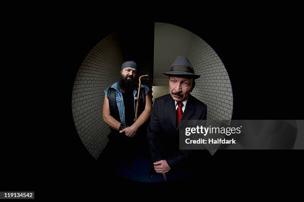 an organized crime boss with his bodyguard, viewed through a peephole - peephole bildbanksfoton och bilder
