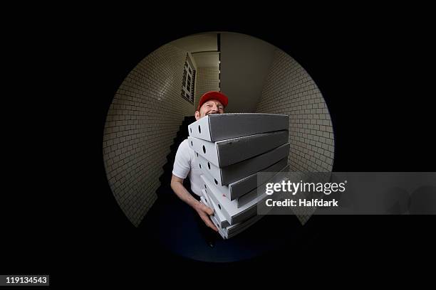 a pizza delivery man, portrait - pizza carrier photos et images de collection
