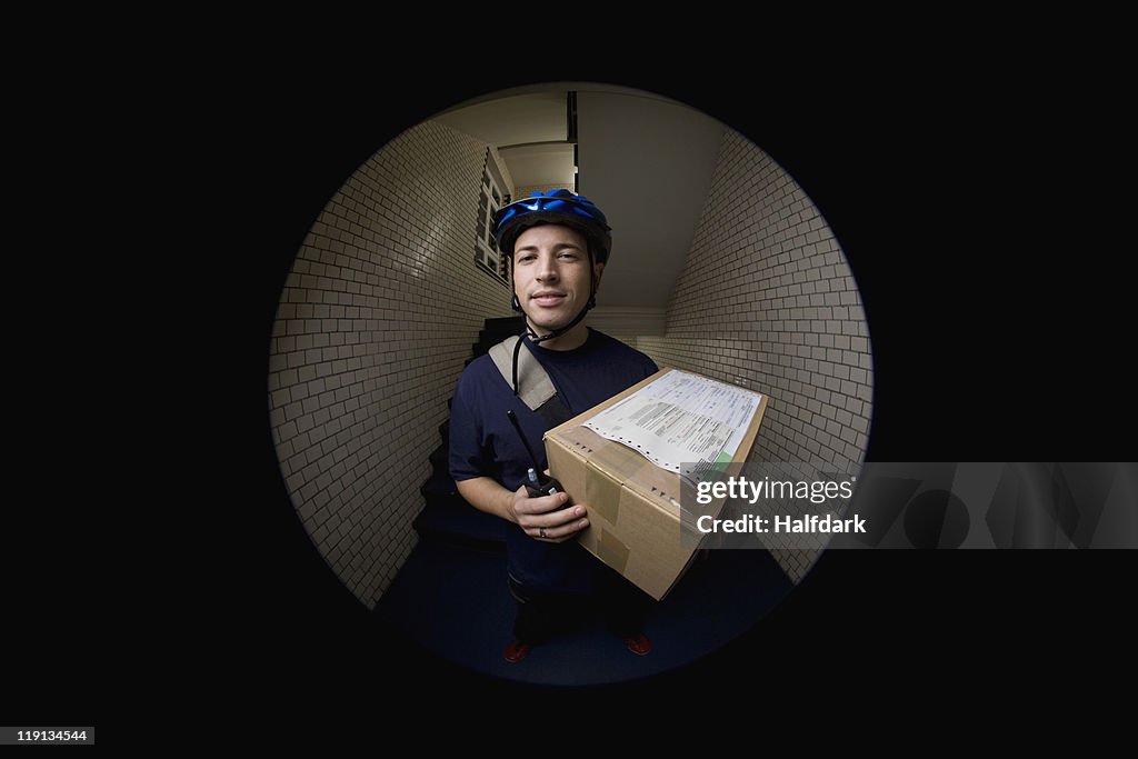 A bicycle messenger delivering a package